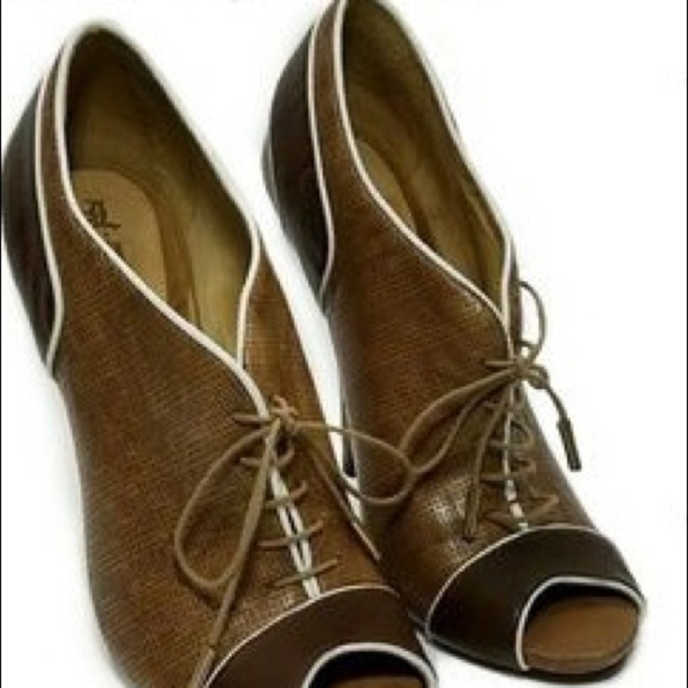 L.A.M.B. brown and white peep-toe bootie.